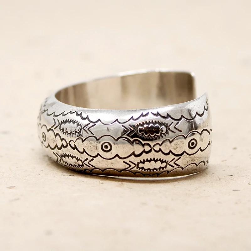 Domed Silver Cuff with Rocker Designs by Bighand