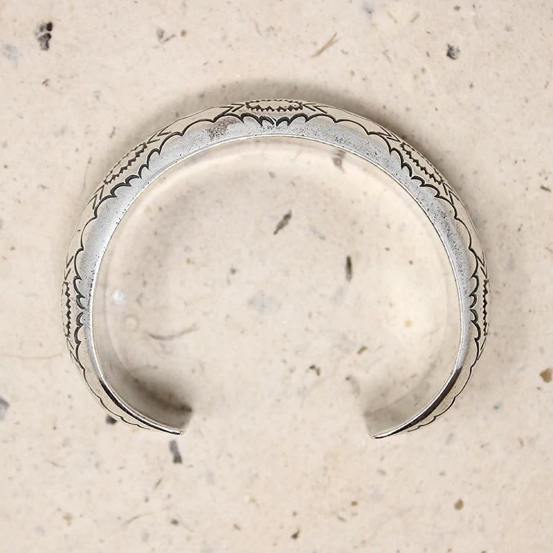 Domed Silver Cuff with Rocker Designs by Bighand