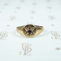 tiny 10k yellow gold signet ring with a star set amethyst