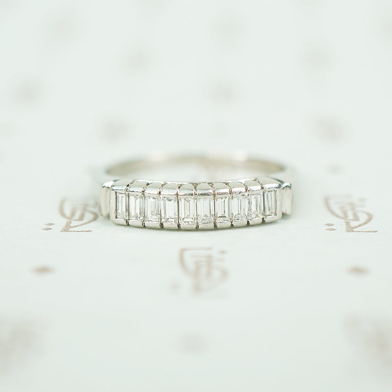 10 straight baguettes set vertically in platinum mid 20th century diamond band