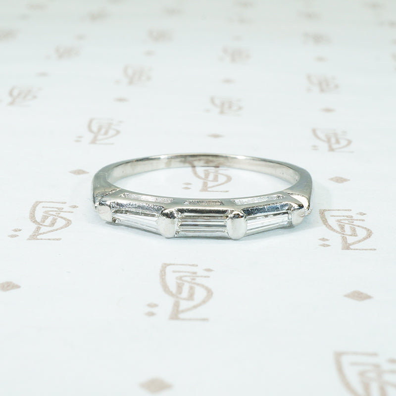 three baguette diamond band in platinum circa 1940