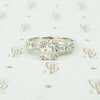 1940's platinum .80 oec diamond ring with diamond baguette sides