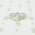 1940's platinum .80 oec diamond ring with diamond baguette sides