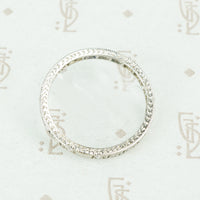 side view of hand engraving platinum diamond eternity band