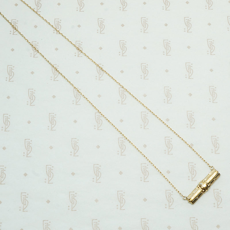 repoussé bar pendant converted from a brooch the decorative vintage bar is 14k and the 17" new recycled gold chain is 14k