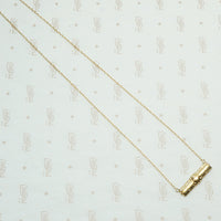 repoussé bar pendant converted from a brooch the decorative vintage bar is 14k and the 17" new recycled gold chain is 14k
