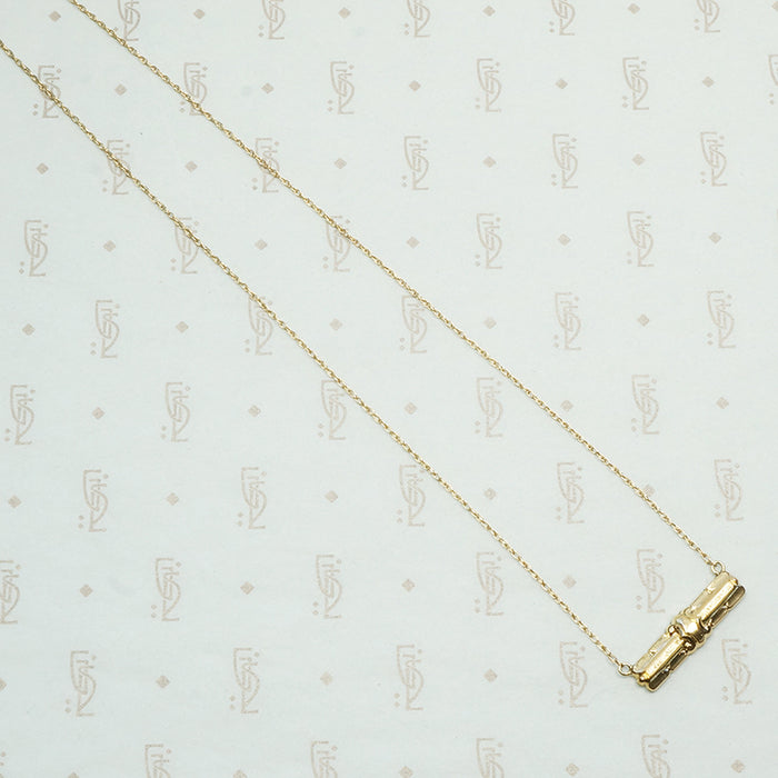 repoussé bar pendant converted from a brooch the decorative vintage bar is 14k and the 17" new recycled gold chain is 14k