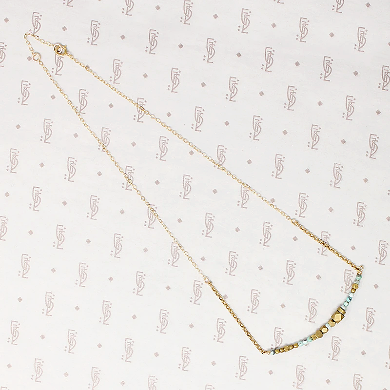 Turquoise & Brass Bead Arc Necklace by Brin
