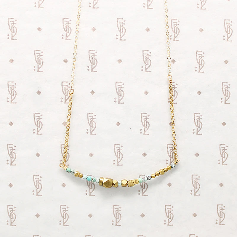 Turquoise & Brass Bead Arc Necklace by Brin