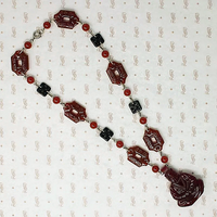 Dramatic Pressed Glass Buddha Necklace