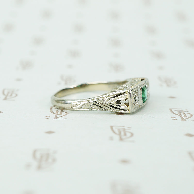 belias white gold filigree 3 stone ring emerald and diamond side view
