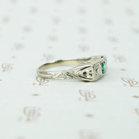 belias white gold filigree 3 stone ring emerald and diamond side view