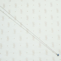 vintage 1/5 carat Montana Sapphire bezel set in recycled 14k white gold and suspend from a matching chain