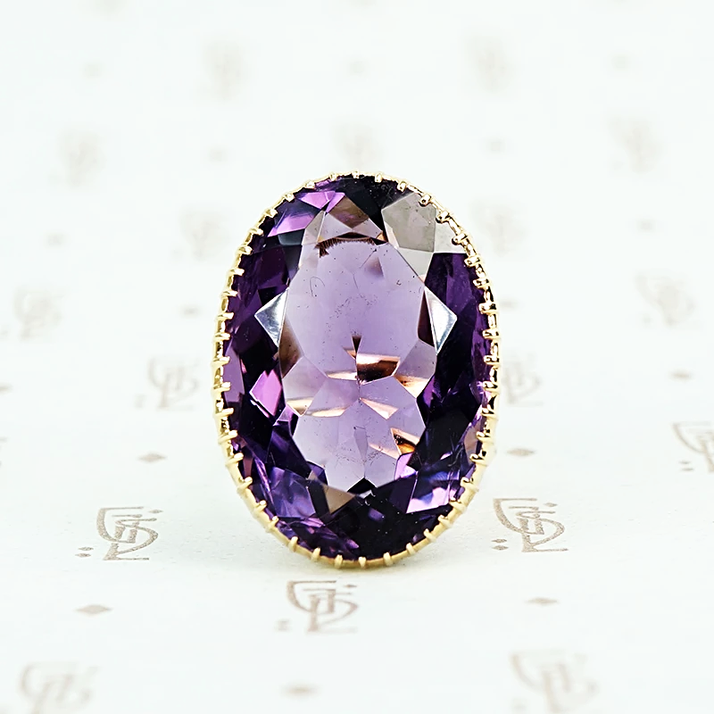 extra big oval amethyst ring in cut back collet 