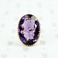 extra big oval amethyst ring in cut back collet 