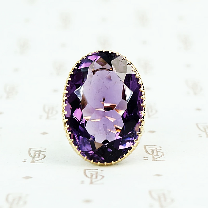 extra big oval amethyst ring in cut back collet 