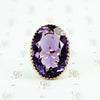 extra big oval amethyst ring in cut back collet 