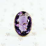 extra big oval amethyst ring in cut back collet 