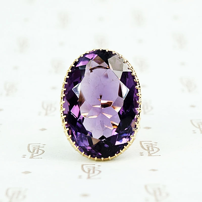 extra big oval amethyst ring in cut back collet 