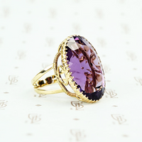 extra big oval amethyst ring in cut back collet