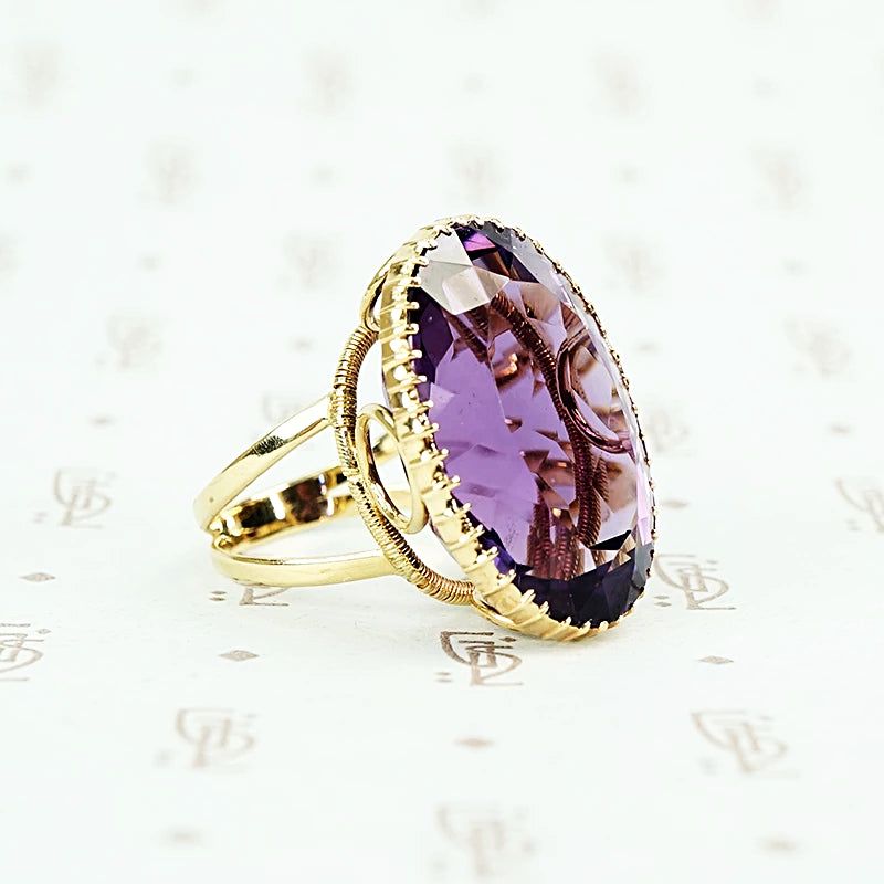 extra big oval amethyst ring in cut back collet