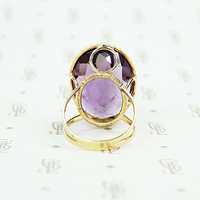 extra big oval amethyst ring in cut back collet side detail of back