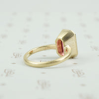 4.47 carat emerald cut pink tourmaline in matte gold ring back