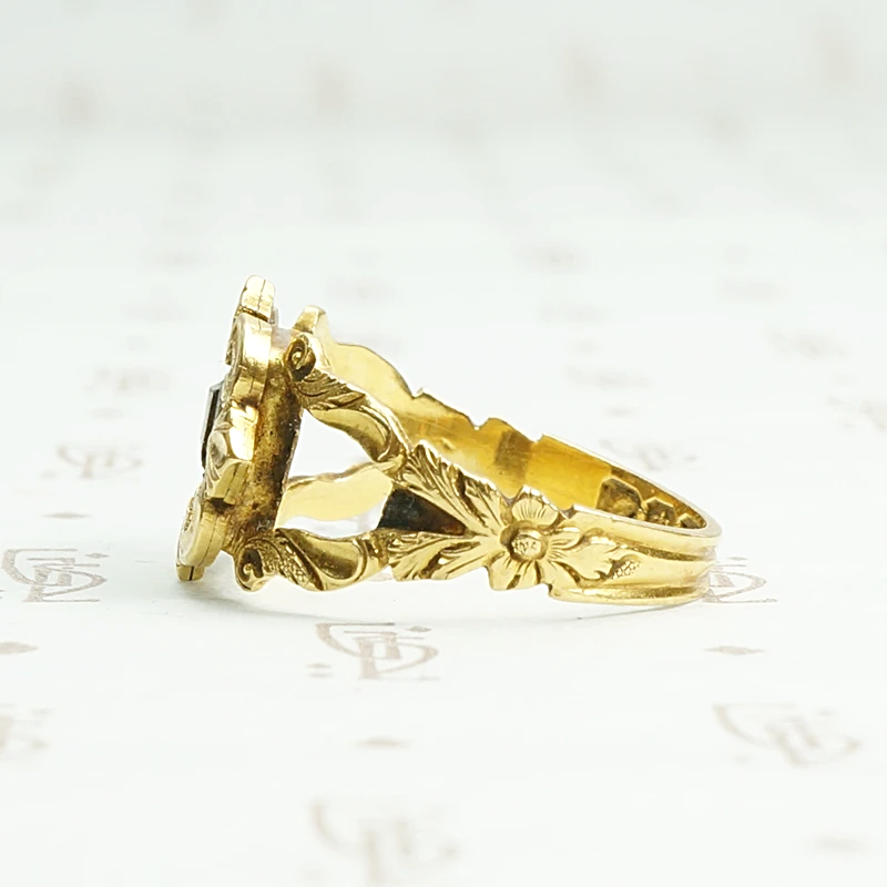 Exquisite 18k gold and enamel early Victorian mourning ring. Left side view.