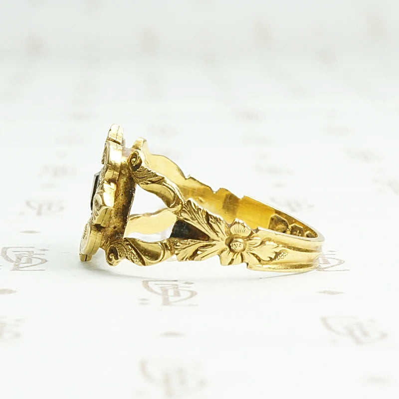 Exquisite 18k gold and enamel early Victorian mourning ring. Left side view.