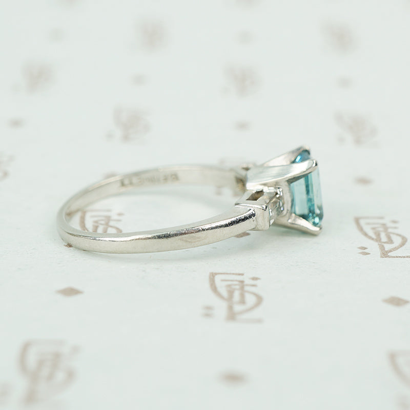 emerald cut aquamarine with baguette diamond sides in platinum side view