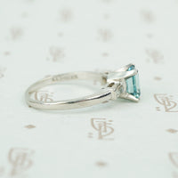 emerald cut aquamarine with baguette diamond sides in platinum side view