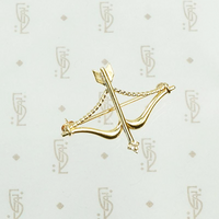 a diamond tipped arrow in a drawn back bow brooch 14k gold