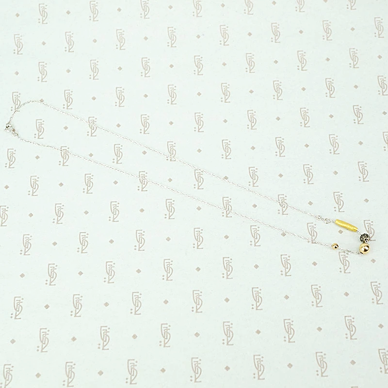 Gold and Diamond Bead Necklace by brunet