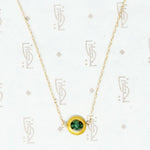 artisan necklace emeralds and recycled gold close up