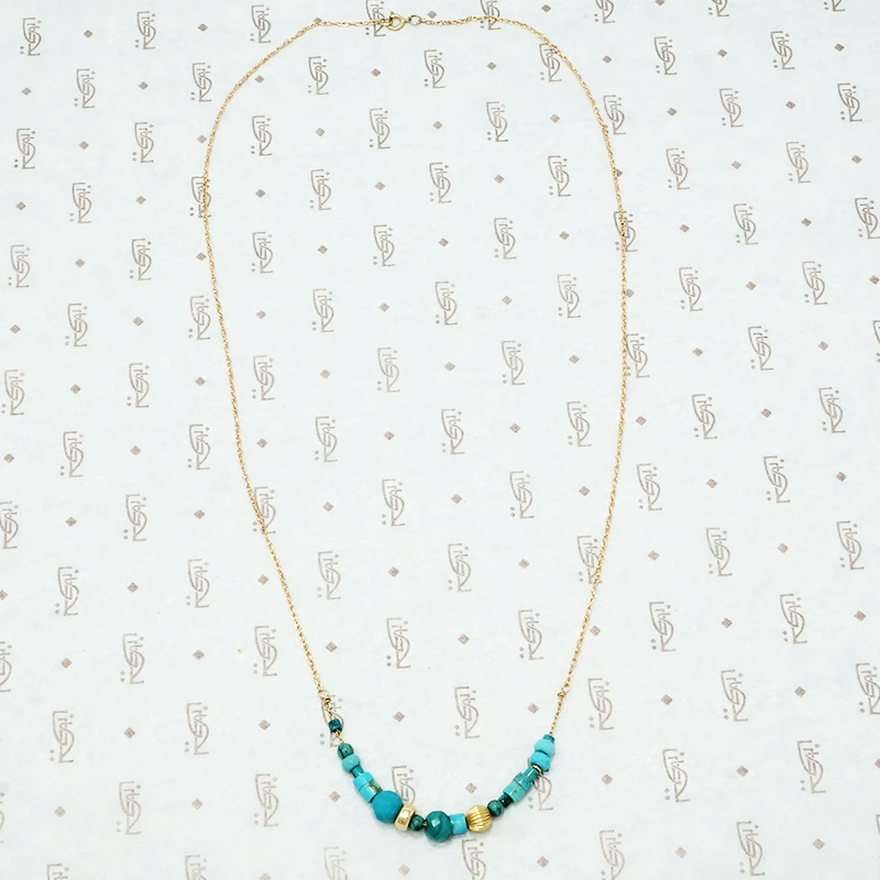 artisan crafted turquoise and gold necklace