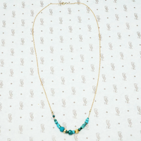 artisan crafted turquoise and gold necklace