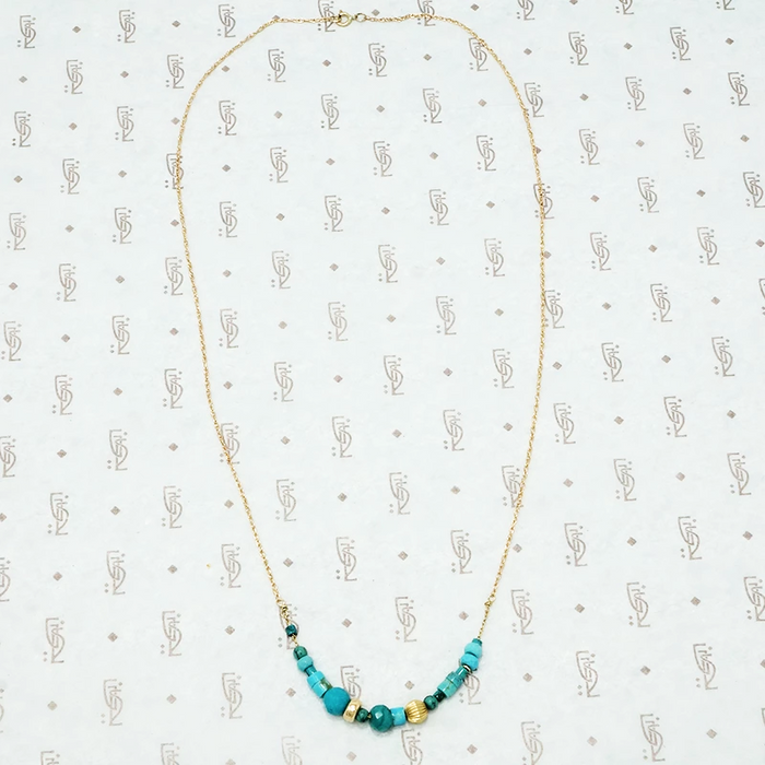 artisan crafted turquoise and gold necklace