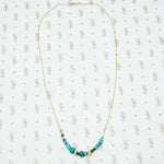 artisan crafted turquoise and gold necklace