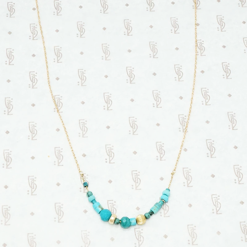 artisan crafted turquoise and gold necklace