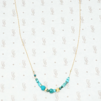 artisan crafted turquoise and gold necklace