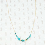artisan crafted turquoise and gold necklace