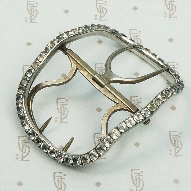 Silver buckle circa 1800 featuring cut back collet set black dot paste stones