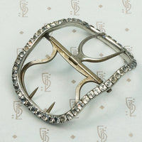 Silver buckle circa 1800 featuring cut back collet set black dot paste stones