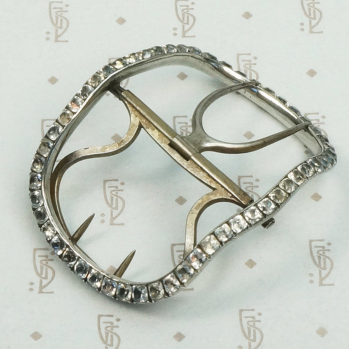 Silver buckle circa 1800 featuring cut back collet set black dot paste stones