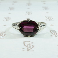 Raspberry Colored Buff Top Cut Garnet in White Gold