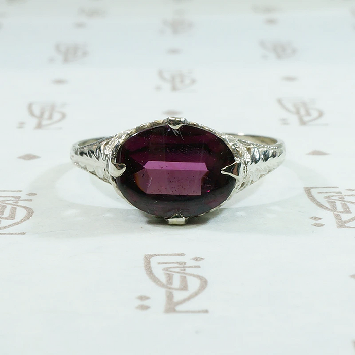 Raspberry Colored Buff Top Cut Garnet in White Gold
