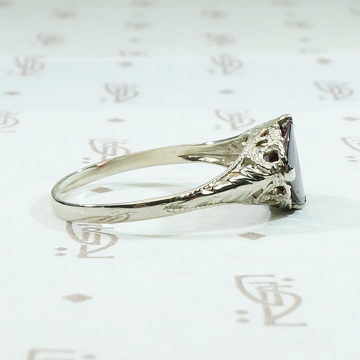 Raspberry Colored Buff Top Cut Garnet in White Gold
