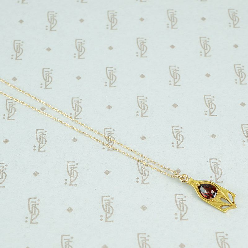 buff top garnet conversion pendant