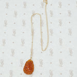 carved amber pendant with birds