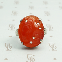 Carved carnelian is silver forget me not setting ring.